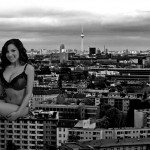 168632 - brunette buildings city cleavage clouds collage giantess monochrome sitting sky smile zed782